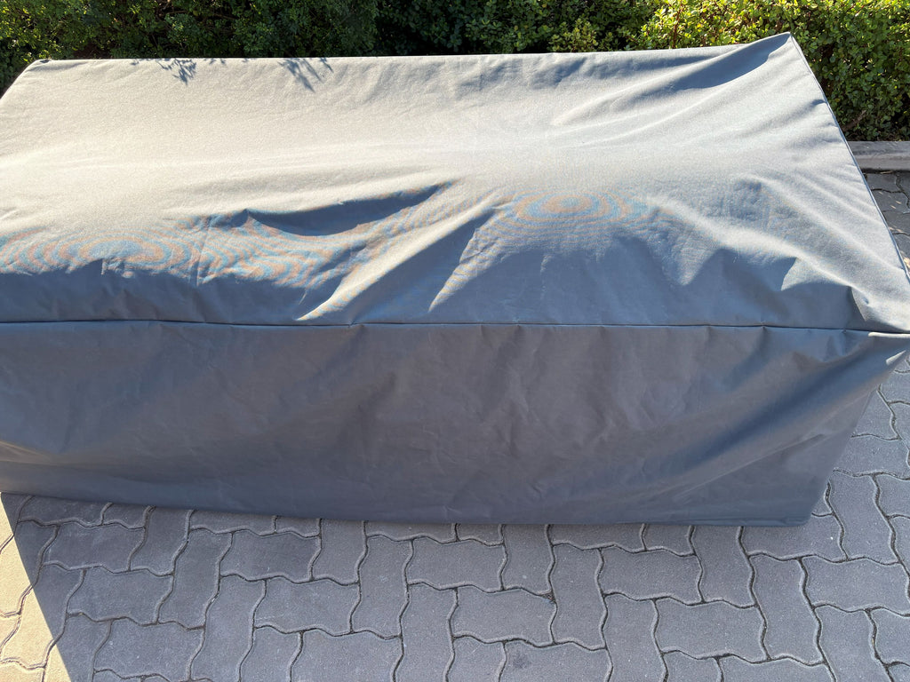 Outdoor Two Seater Cover in waterproof Oxford fabric fitted over a patio sofa