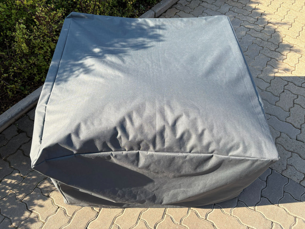 Outdoor Single Seater Cover in waterproof Oxford fabric fitted over a patio sofa