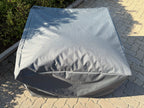 Outdoor Single Seater Cover in waterproof Oxford fabric fitted over a patio sofa
