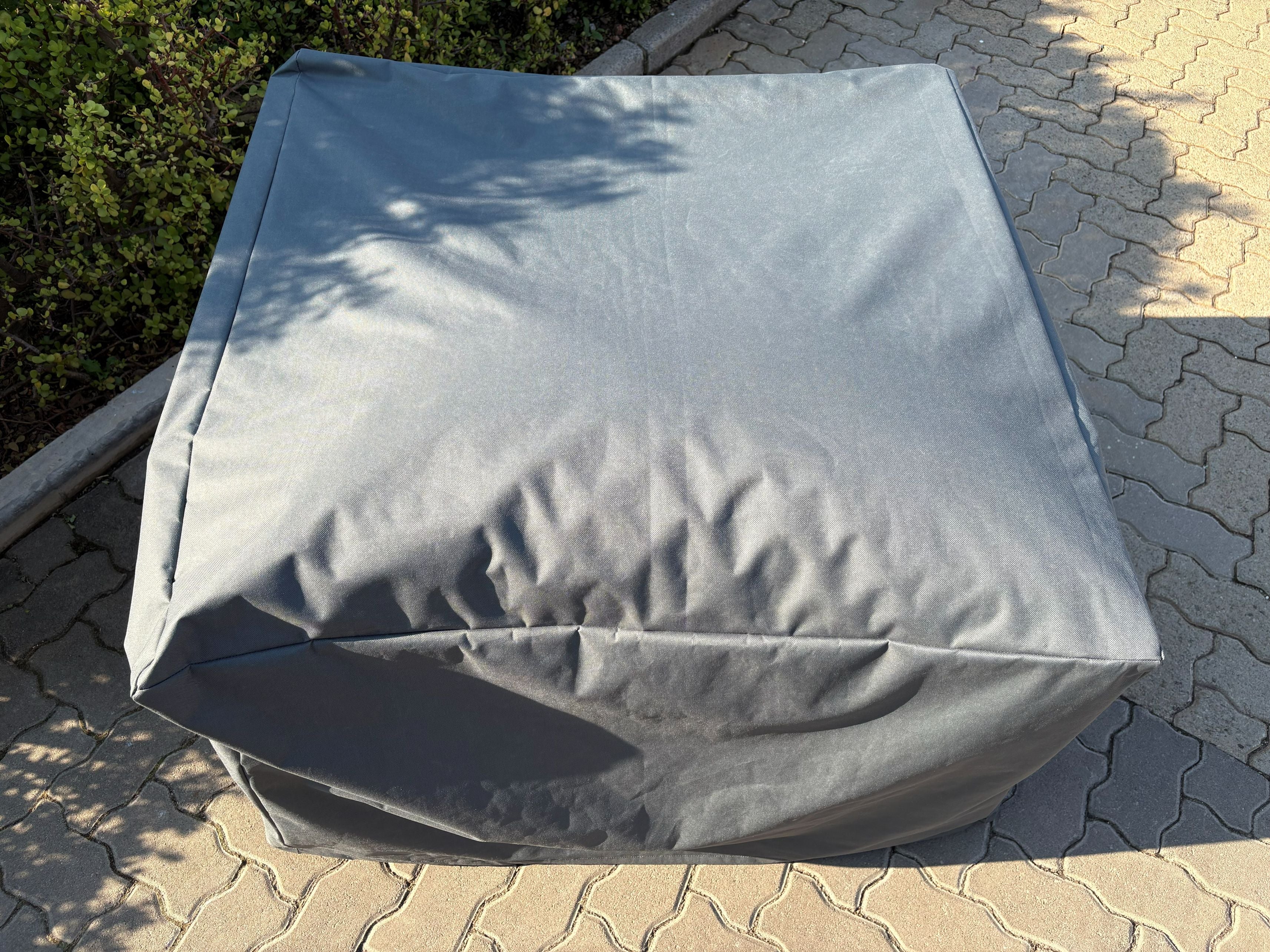Outdoor Single Seater Cover in waterproof Oxford fabric fitted over a patio sofa