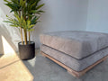 Velorra Luma Ottoman in Luma fabric on a solid Red Oak base